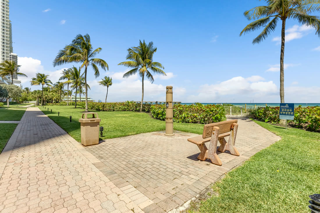 Landscaped beachfront walkway and seating area at Oceania, Sunny Isles Beach