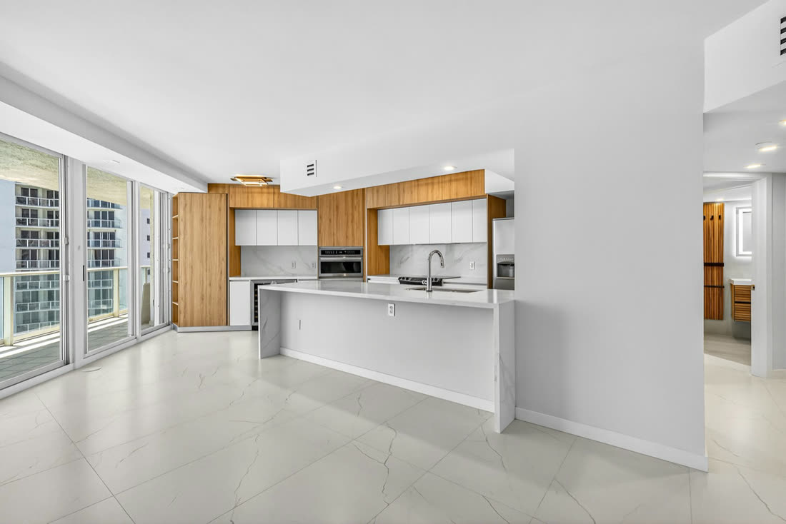 Renovated living and kitchen interior, Oceania II Unit 922