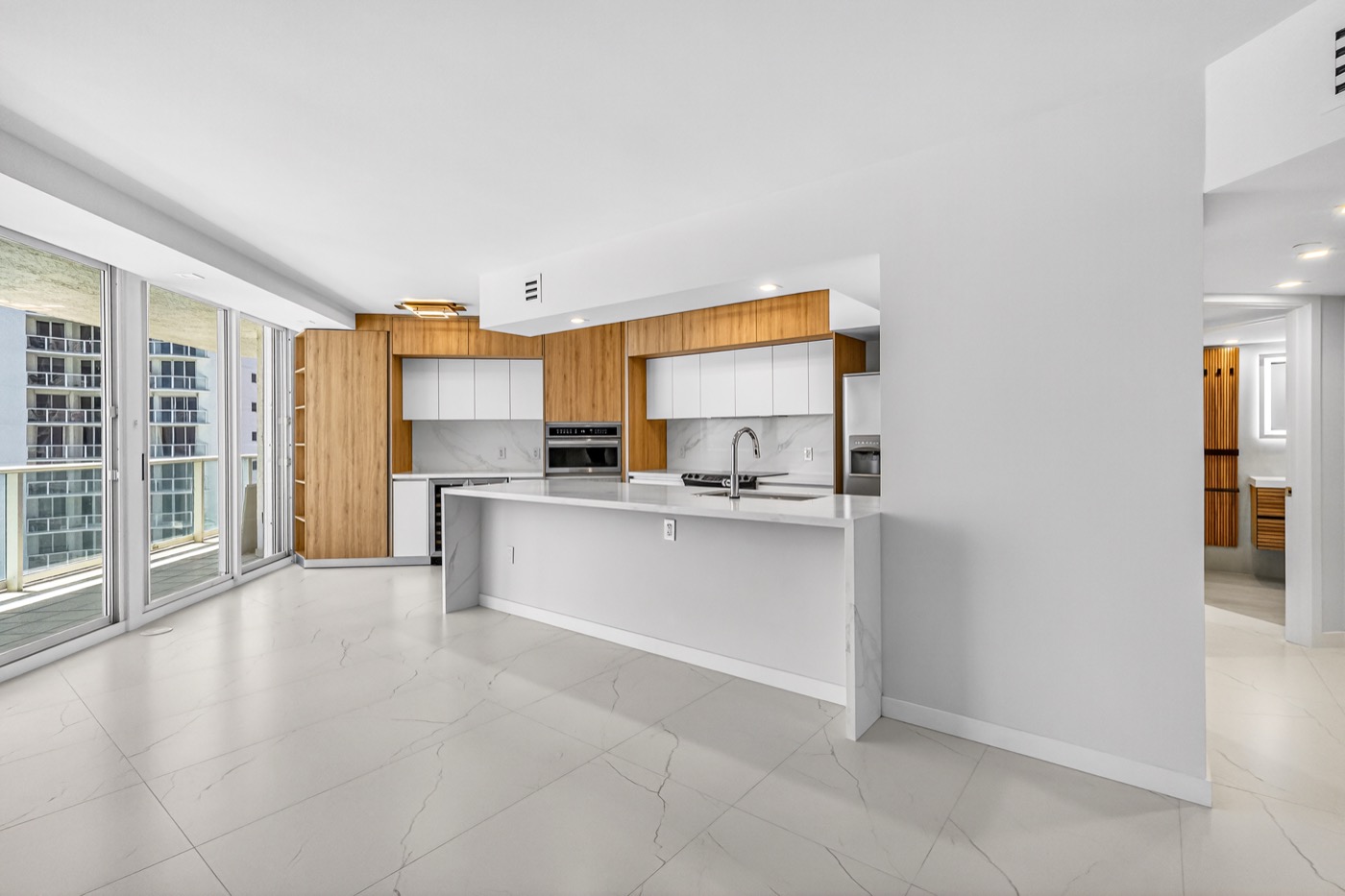 Renovated living and kitchen interior, Oceania II Unit 922